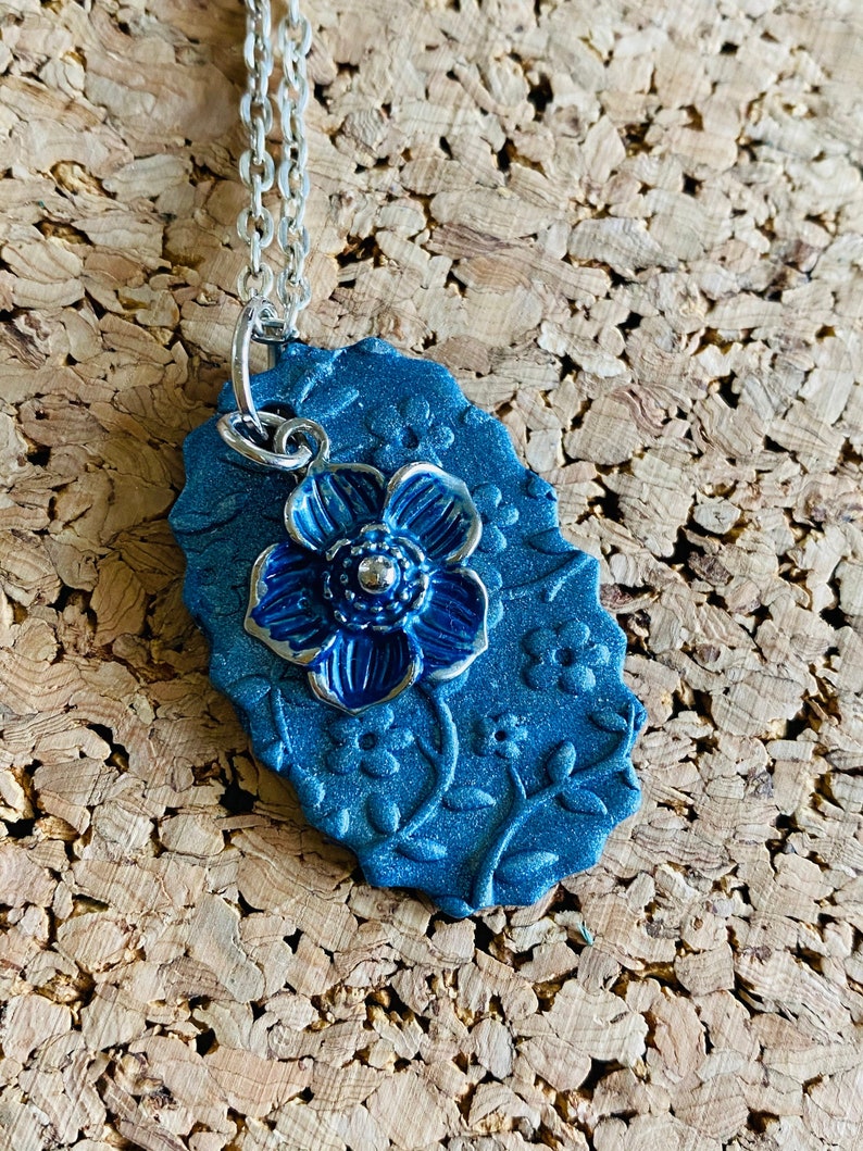 Blue flower stamped clay necklace