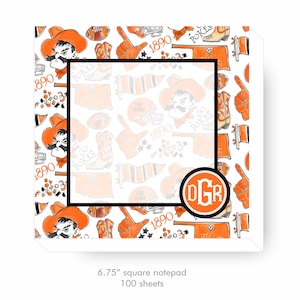 May include: Square notepad with a white background and a repeating pattern of orange and black illustrations. The design includes cowboy hats, footballs, boots, and the text "1890" and "Go Pokes". The notepad measures 6.75 inches square.