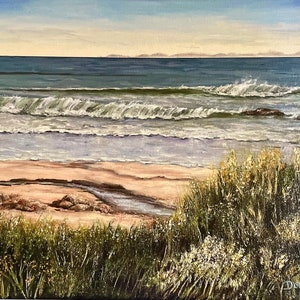 May include: A painting of a seascape with waves crashing on a sandy beach. The beach is lined with green grass and wildflowers. The horizon is in the distance with a blue sky.