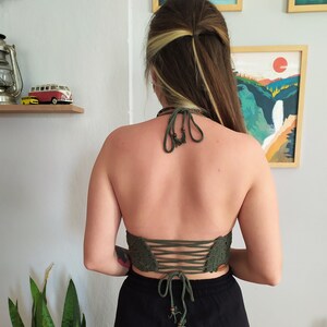• Back view of crochet top with criss-cross ties