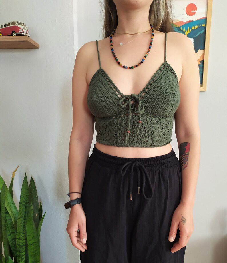 • Handmade granny square halter top styled with black pants