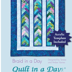May include: Quilt in a Day pattern for a "Braid in a Day" quilt. The quilt features a blue, green, and purple color scheme with a white background. The pattern includes an acrylic template.