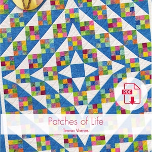 May include: A quilt pattern called "Patches of Life" by Teresa Varness. The quilt features a colorful patchwork design with blue, white, and green squares. The quilt is part of a "Quilt in a Day" series.