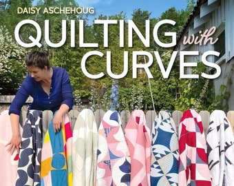 May include: A book titled "Quilting with Curves" by Daisy Aschehoug, featuring 20 geometric projects. The cover shows a woman standing in front of a fence with colorful quilts hanging on it.