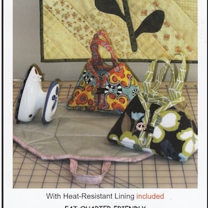 May include: A sewing pattern for a travel iron tote and ironing pad. The tote is made from colorful fabric and has a heat-resistant lining. The pattern is fat quarter friendly and sized to hold a mini travel iron.  The image shows a finished tote and ironing pad, along with a mini travel iron.