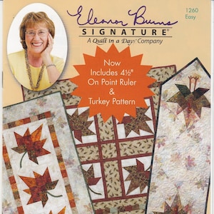 May include: Quilt in a Day pattern for an Autumn Leaves table runner. The pattern includes a 4 1/2 inch on point ruler and a turkey pattern. The pattern is designed by Eleanor Burns.