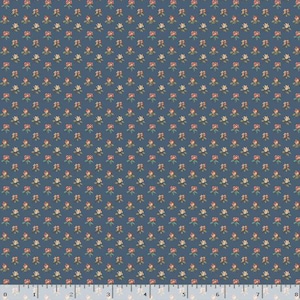 May include: A blue fabric with a repeating pattern of small red and white flowers with green leaves. The flowers are evenly spaced across the fabric. The fabric has a ruler along the bottom edge.