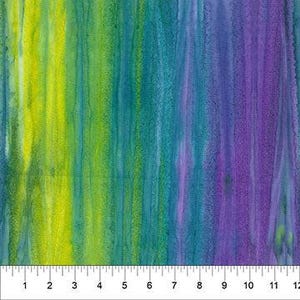 May include: A vibrant fabric with a watercolor effect, featuring vertical streaks of yellow, teal, and purple. A ruler is placed at the bottom, showing measurements in inches.