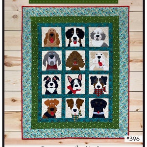May include: A quilt pattern featuring 12 different dog breeds in a window design. The quilt is green and blue with a floral pattern. The title of the pattern is "Doggies in the Window" and the pattern number is #396. The quilt is 43 inches by 52 inches.