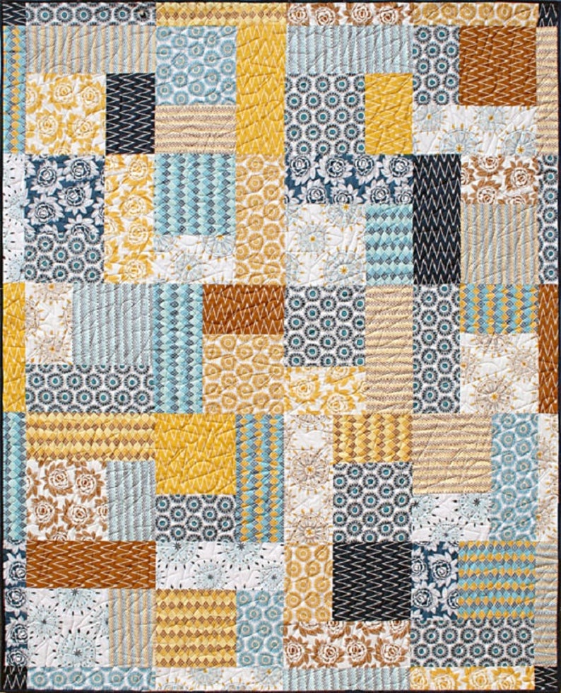 May include: A patchwork quilt with a variety of geometric and floral patterns in shades of blue, yellow, brown, and white.