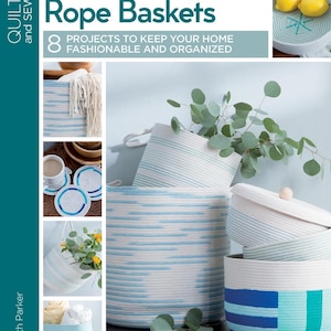 May include: A book cover with the title "Learn to Make Rope Baskets" and a photo of various rope baskets in blue and white. The book cover also includes the text "8 Projects to Keep Your Home Fashionable and Organized".