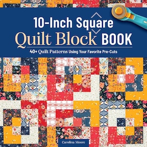 May include: A book titled "10-Inch Square Quilt Block BOOK" with a colorful quilt block pattern on the cover. The cover also features a rotary cutter and the text "40+ Quilt Patterns Using Your Favorite Pre-Cuts."