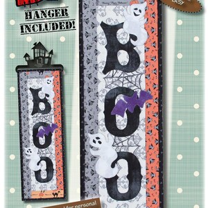 May include: Halloween-themed fabric banner with the word "BOO" in black letters, featuring a purple bat and white ghost appliqués. The banner is 6 inches wide and 18 inches long, with a hanger included. The design includes Halloween cats and pumpkins.
