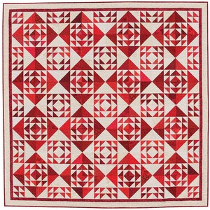 May include: A red and white quilt with a geometric pattern. The quilt is made up of squares and triangles, and the colours are arranged in a repeating pattern.