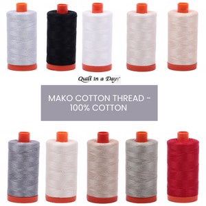 May include: Ten spools of Mako Cotton Thread, 100% cotton, in various colors including white, black, beige, gray, and red. The spools are labeled "Quilt in a Day".