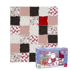 May include: A patchwork quilt featuring alternating squares of Christmas-themed fabric patterns including Santa Claus, candy canes, and reindeer, alongside a rectangular product box labeled The Santa Suit Quilt Kit with illustrations of Santa.