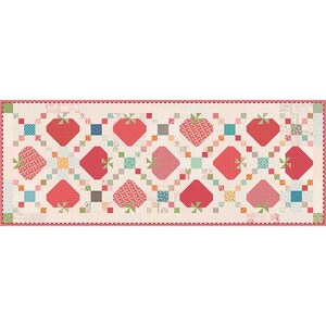 May include: A rectangular quilt featuring a repeating pattern of strawberries. The strawberries are in shades of red and pink, with green stems. The quilt has a cream-colored background with small, colorful square accents and a scalloped border.