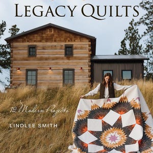 May include: A book cover titled "Lone Star Legacy Quilts" with a woman holding a quilt in front of a rustic cabin. The quilt features a starburst design in shades of orange, black, and white. The book cover also includes the text "12 Modern Projects" and the author's name, Lindlee Smith.