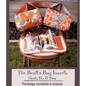 May include: An advertisement for "The Beatle Bag Inserts" by Abbey Lane Quilts. The image features two colorful quilted handbags, one with floral patterns and the other with white polka dots. The text reads "Grab, Go & Sew" and "Package contains 4 Inserts".