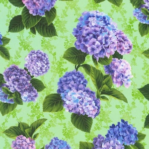 May include: A seamless fabric pattern featuring clusters of purple and blue hydrangeas on a light green background.
