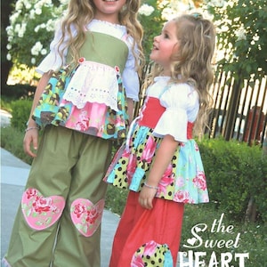 May include: Two girls wearing colorful patchwork dresses with heart-shaped patches on their pants. The text "the sweet HEART pants NO.16" is visible in the image.