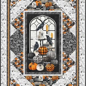 May include: A Halloween-themed quilt featuring a central window scene with pumpkins, ravens, and candles. The quilt has a black, white, and orange color scheme with a border of patterned fabric and text. The text includes the words "Hocus Pocus".