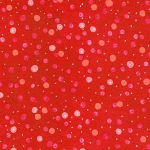 May include: Close-up of a red fabric with a pattern of pink and white polka dots. The polka dots vary in size and shade, creating a playful and textured design. The fabric has a slightly textured appearance.