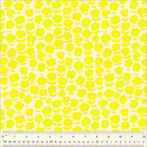 May include: A white fabric with a repeating pattern of yellow stylized flowers. The fabric is measured with a ruler in inches.