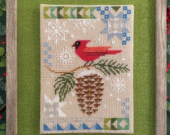 Seasonal Courier: Cardinal's Winter Cross Stitch Pattern by Robin Pickens