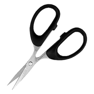 May include: Black handled scissors with silver blades. The scissors are small and have the text "Elan Stainless Japan" printed on the blade.
