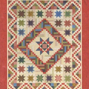 May include: A quilt pattern called "Monterrey Medallions" by Atkinson Designs. The quilt features a large star in the center surrounded by smaller stars in various colors. The quilt is made up of squares and triangles in a variety of colors and patterns.