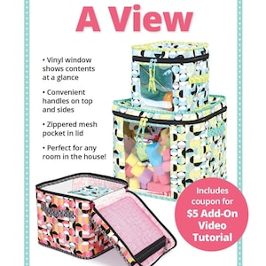 May include: Three colorful zippered storage bins with clear vinyl windows. The bins are stacked on top of each other. The largest bin is filled with colorful foam blocks. The text "Room With A View" is at the top of the image. The text "Includes coupon for $5 Add-On Video Tutorial" is in the lower right corner of the image. The text "Sturdy zippered bins in three sizes!" is at the bottom of the image.