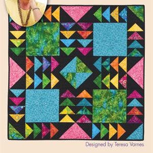 Może przedstawiać: Wzór patchworku zatytułowany "Fox & Geese" z kolekcji Eleanor Burns Signature Quilt in a Day. Wzór przedstawia kolorowy projekt patchworku z czarnym tłem i geometrycznymi kształtami.