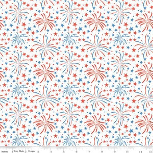 May include: White fabric with a repeating pattern of red and blue fireworks and stars. The design includes stylized fireworks bursts and scattered stars in red and blue, creating a festive and patriotic theme. The fabric is measured in inches.