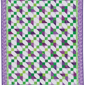 May include: A quilt with a geometric pattern of green and purple squares and triangles. The quilt is bordered with a purple floral pattern.