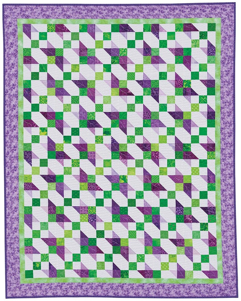 May include: A quilt with a geometric pattern of green and purple squares and triangles. The quilt is bordered with a purple floral pattern.