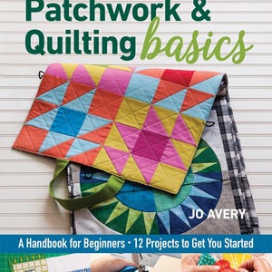 May include: Book cover with the title "NEW Patchwork & Quilting basics" by Jo Avery. The cover features a colorful patchwork quilt and a close-up of a sewing machine, fabric, and a hand stitching a quilt.
