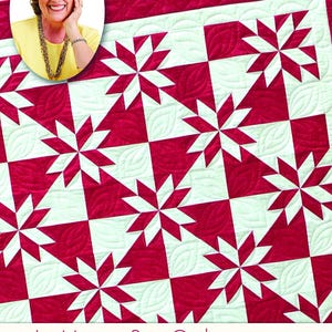 May include: A red and white quilt with a star pattern. The quilt features a repeating design of red starbursts on a white background. The words "Quilt in a Day" and "Le Moyne Star Quilt" are visible.