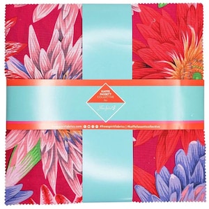 May include: A red fabric square with a floral print featuring pink, red, and blue flowers. The fabric is from the Kaffe Fassett Collective for Free Spirit Fabrics. The text "Kaffe Fassett Collective for Free Spirit" is printed on a white label with a blue border.