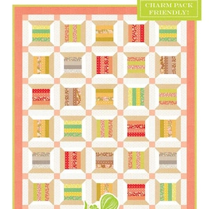May include: A colorful quilt with a repeating pattern of spools, featuring various fabrics in shades of green, yellow, red, and brown. The quilt is bordered with a peach-colored frame. Text on the image reads "Summer Spools" and "Charm Pack Friendly!"