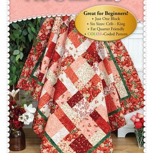 May include: A quilt pattern featuring a red, white, and green floral design. The pattern is called "Easy as ABC and 123" and is great for beginners. It includes one block, six sizes, and is fat quarter friendly. The pattern is color-coded.