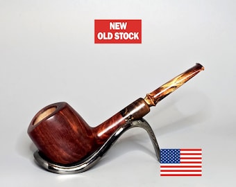 May include: A red and brown wooden pipe with a gold and brown stem. The pipe is on a silver stand and the words "NEW OLD STOCK" are printed on a red rectangle.