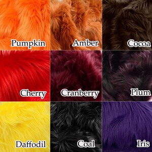 May include: A grid of nine swatches of long-pile faux fur in various colors, each labeled with text: Pumpkin, Amber, Cocoa, Cherry, Cranberry, Plum, Daffodil, Coal, and Iris. The textures are dense and shaggy, displaying a vibrant color palette.