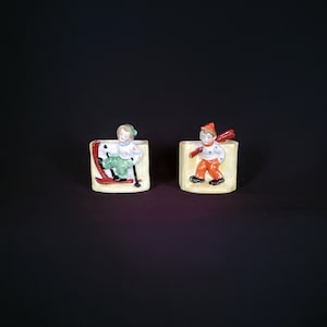 Occupied Japan Pair of Planters, Boy and Girl Skiers   #542