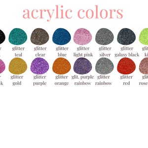 May include: A collection of 14 small round jars filled with different colored glitter. The jars are labeled with the color of the glitter, such as "glitter black", "glitter teal", "glitter clear", and "glitter blue".
