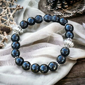 Zwarte onyx en zilverkleurige metalen stretcharmband met kralen