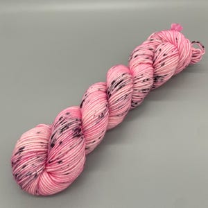 Hand Dyed Yarn, 100% Superwash Merino Wool, DK Weight, Pink, Black Speckles - 231yds per skein - Trina Rose