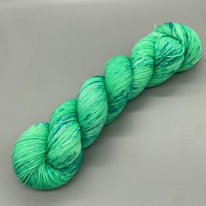 Hand Dyed Yarn, Superwash 75% Merino Wool, 25 Nylon Fingering, Green base, Blue Speckles - 463yds per skein