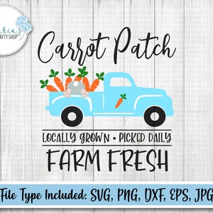 May include: A blue pickup truck with a white bed is filled with carrots. A gray bunny rabbit is peeking out from the back of the truck. The text "Carrot Patch" is above the truck and "Locally Grown - Picked Daily FARM FRESH" is below the truck.
