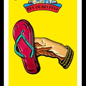 May include: A yellow card with the number 8 and the text "REY OCHO PINZ" in a red banner. The card features a cartoon hand holding a red flip-flop with a turquoise strap. The text "LA CHANCLA" is at the bottom of the card.